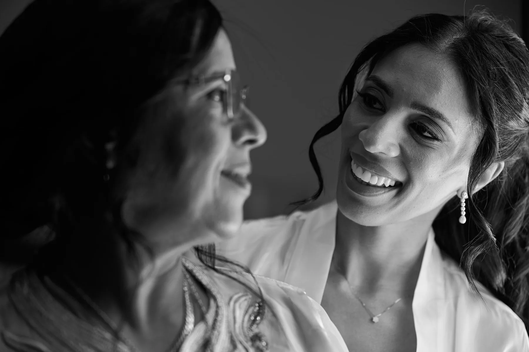 Hanan and her mother while getting ready, in black and white