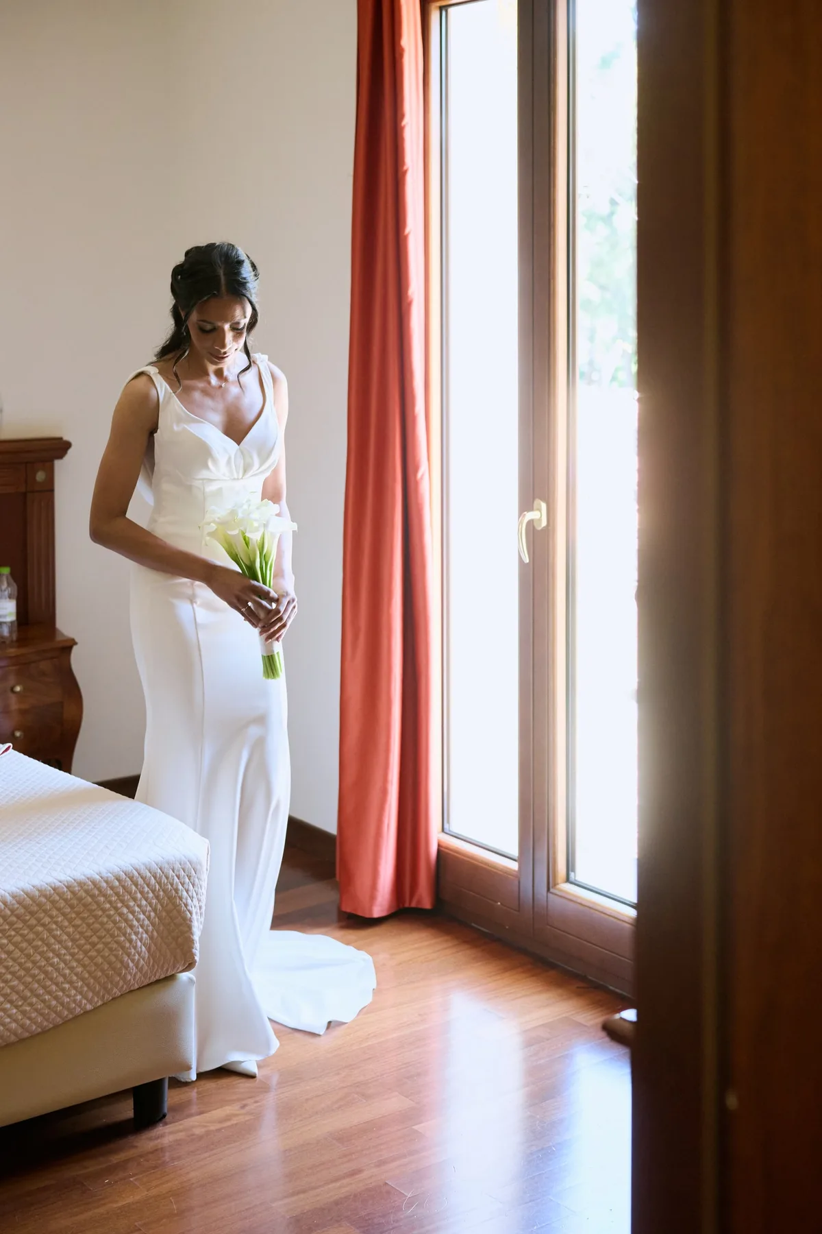 Hanan in her wedding dress in the room