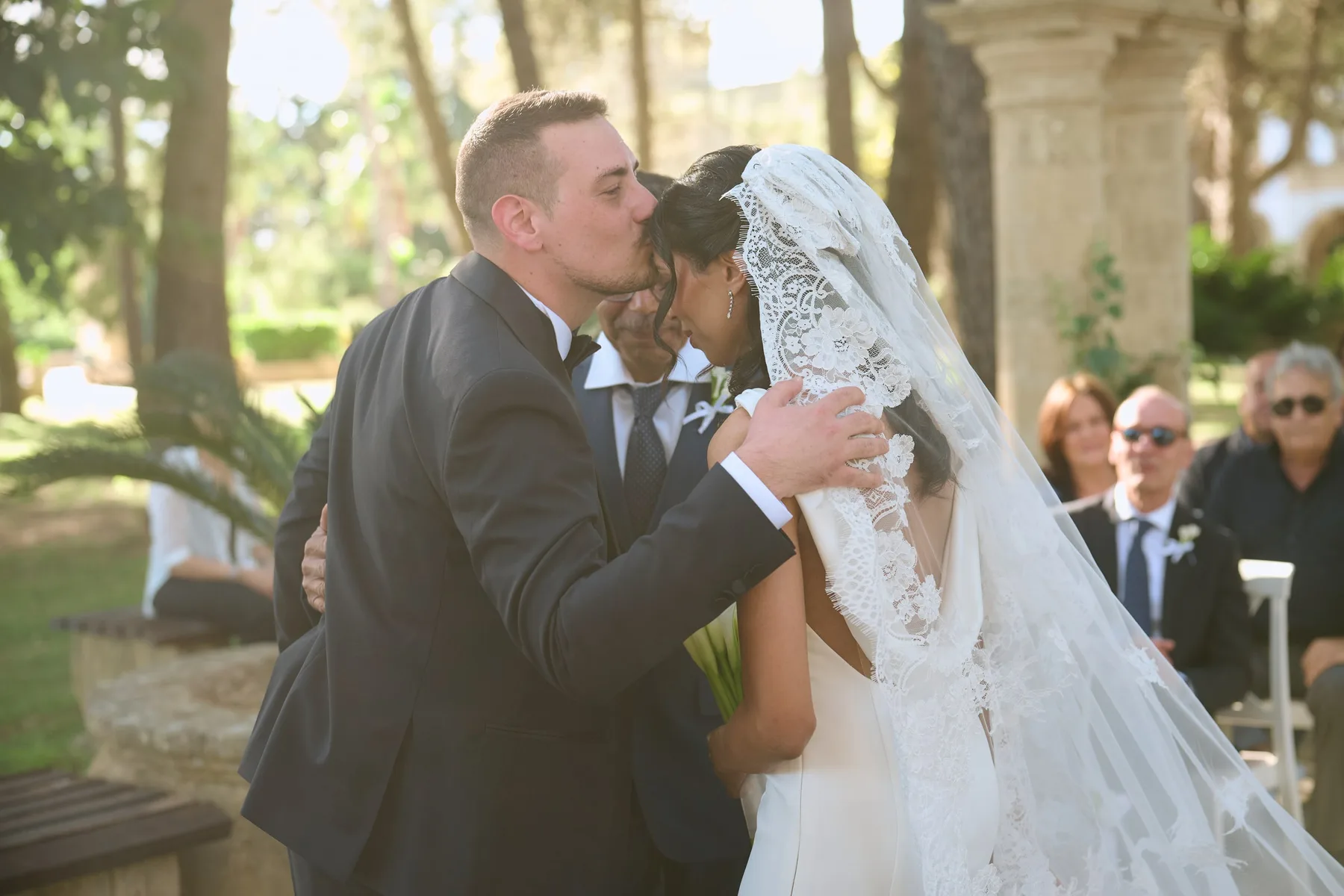 Diego kissing Hanan on the forehead at the altar