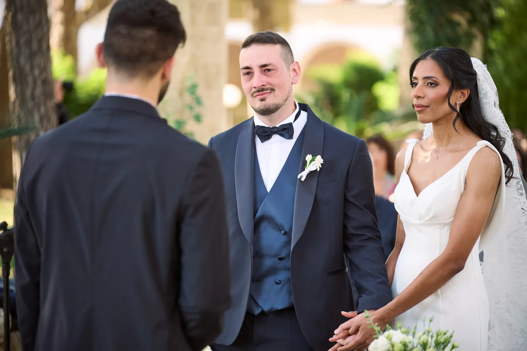Diego and Hanan smiling during the ceremony