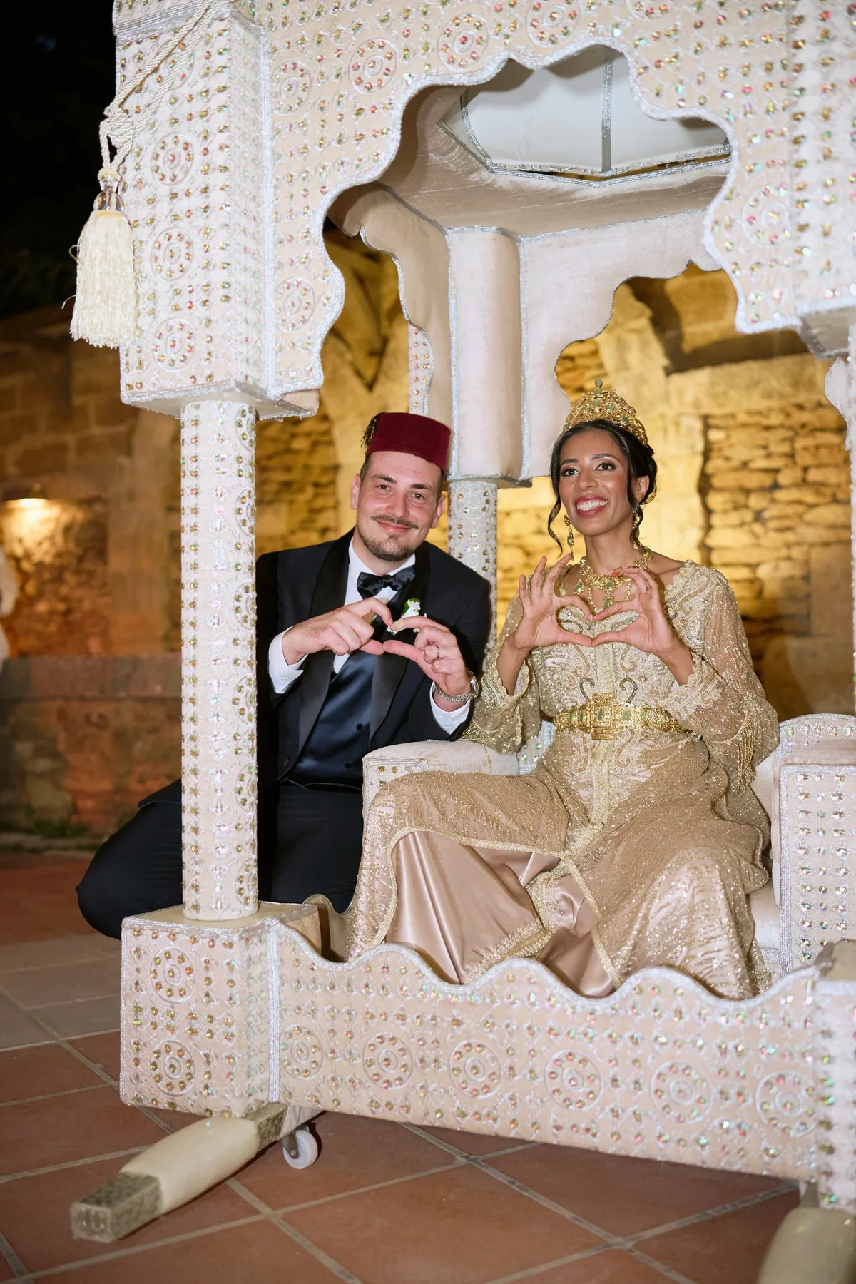 Diego and Hanan on the amaria making a heart with their hands