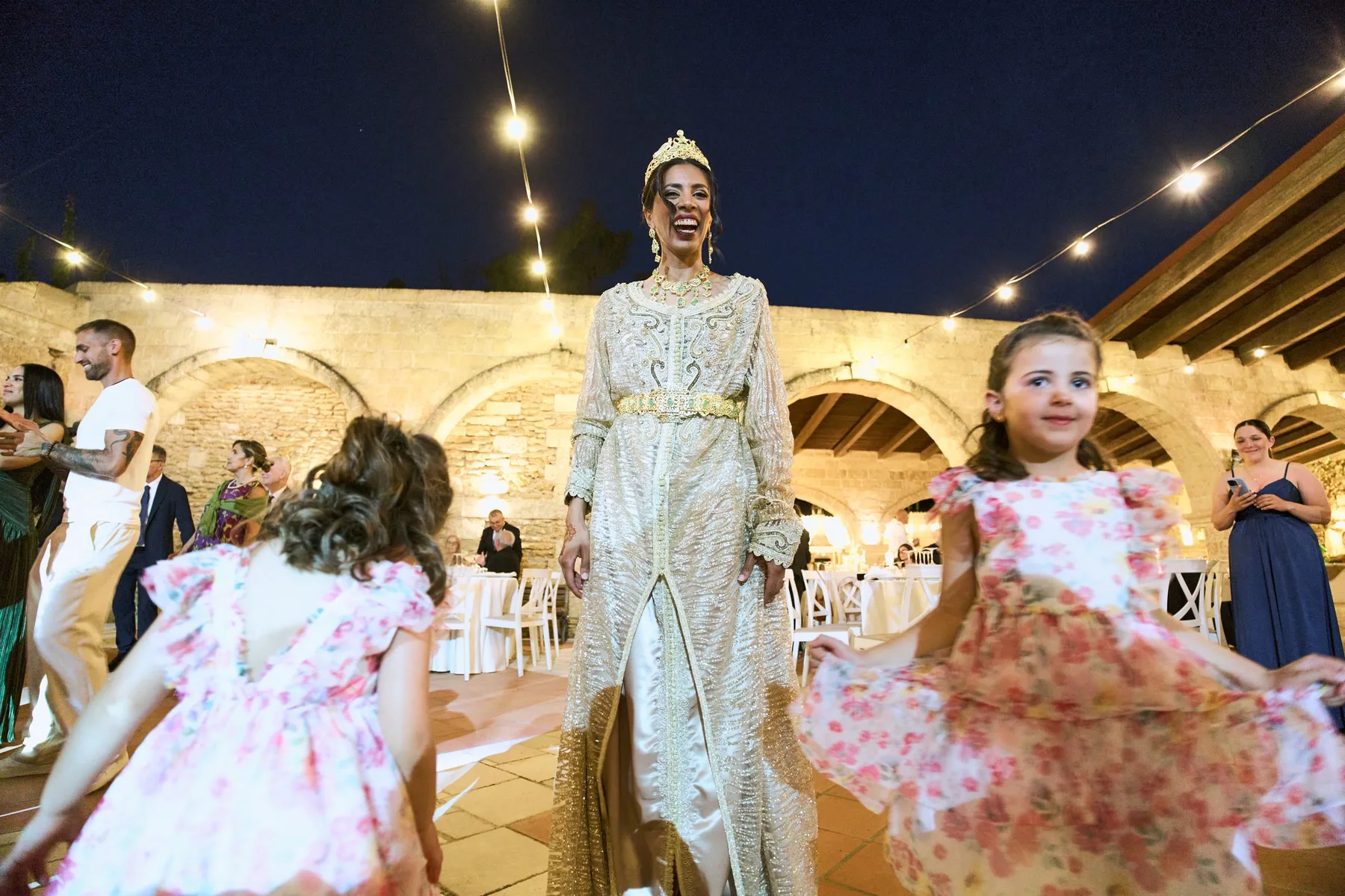 Hanan dancing with the children under the lights