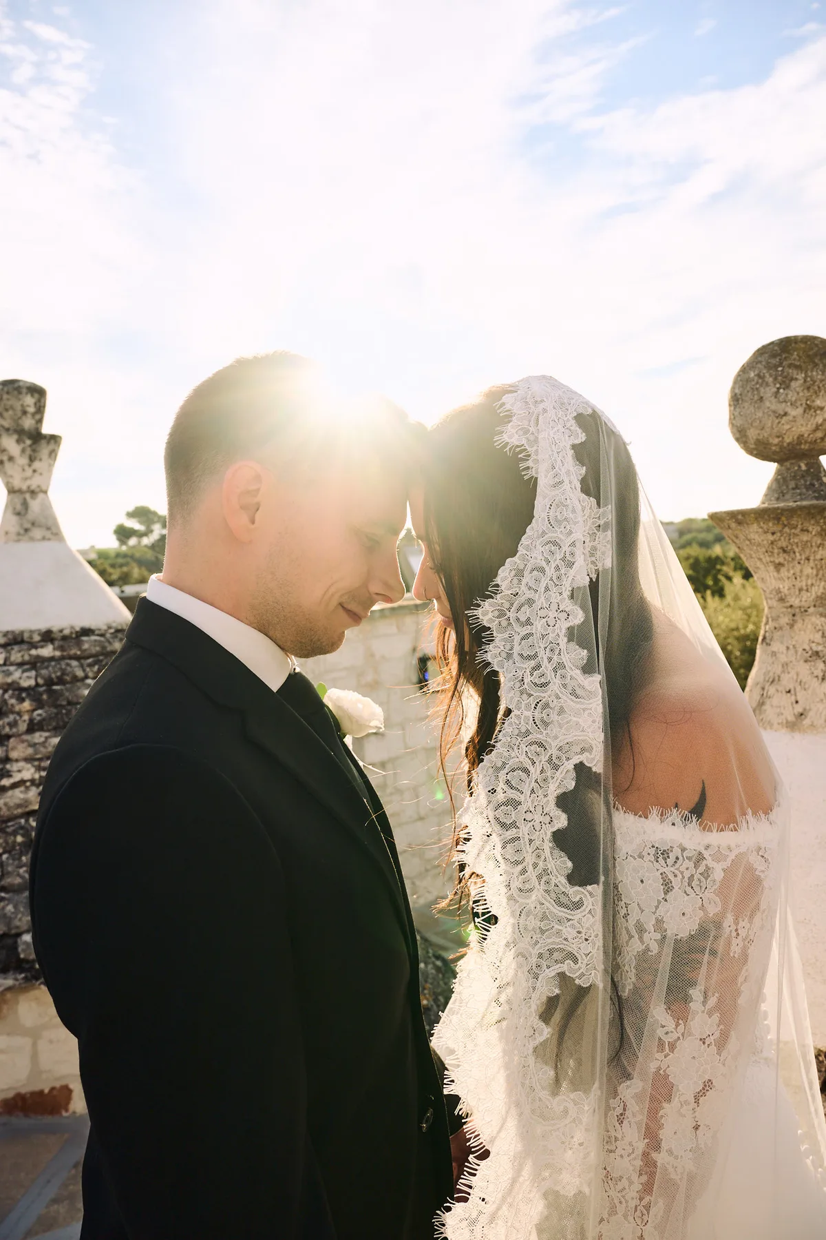 Jenny and Brad forehead to forehead against the light
