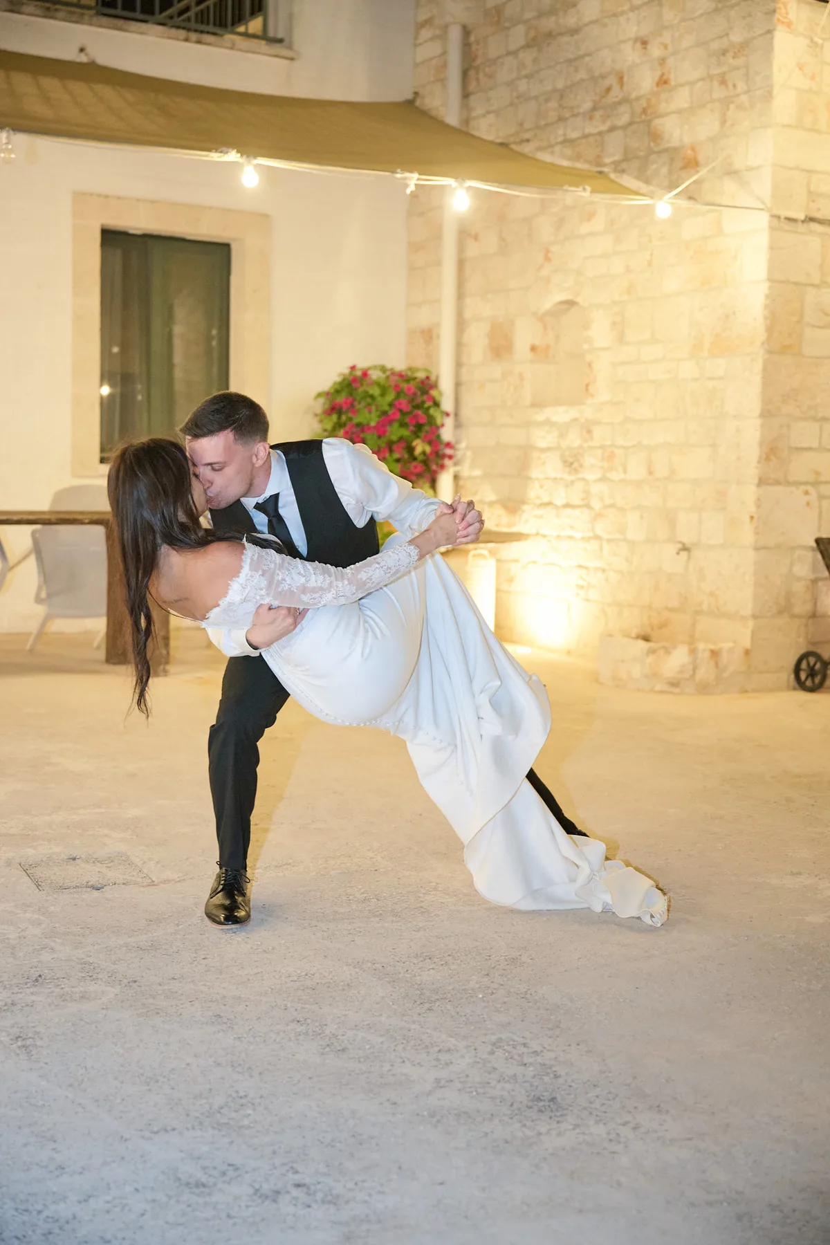 The dip at the end of the first dance in the courtyard