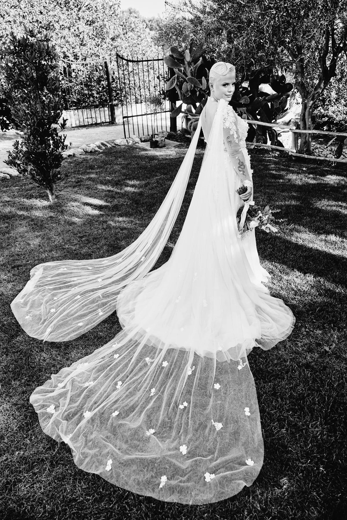 Natasha's long veil on the lawn, in black and white