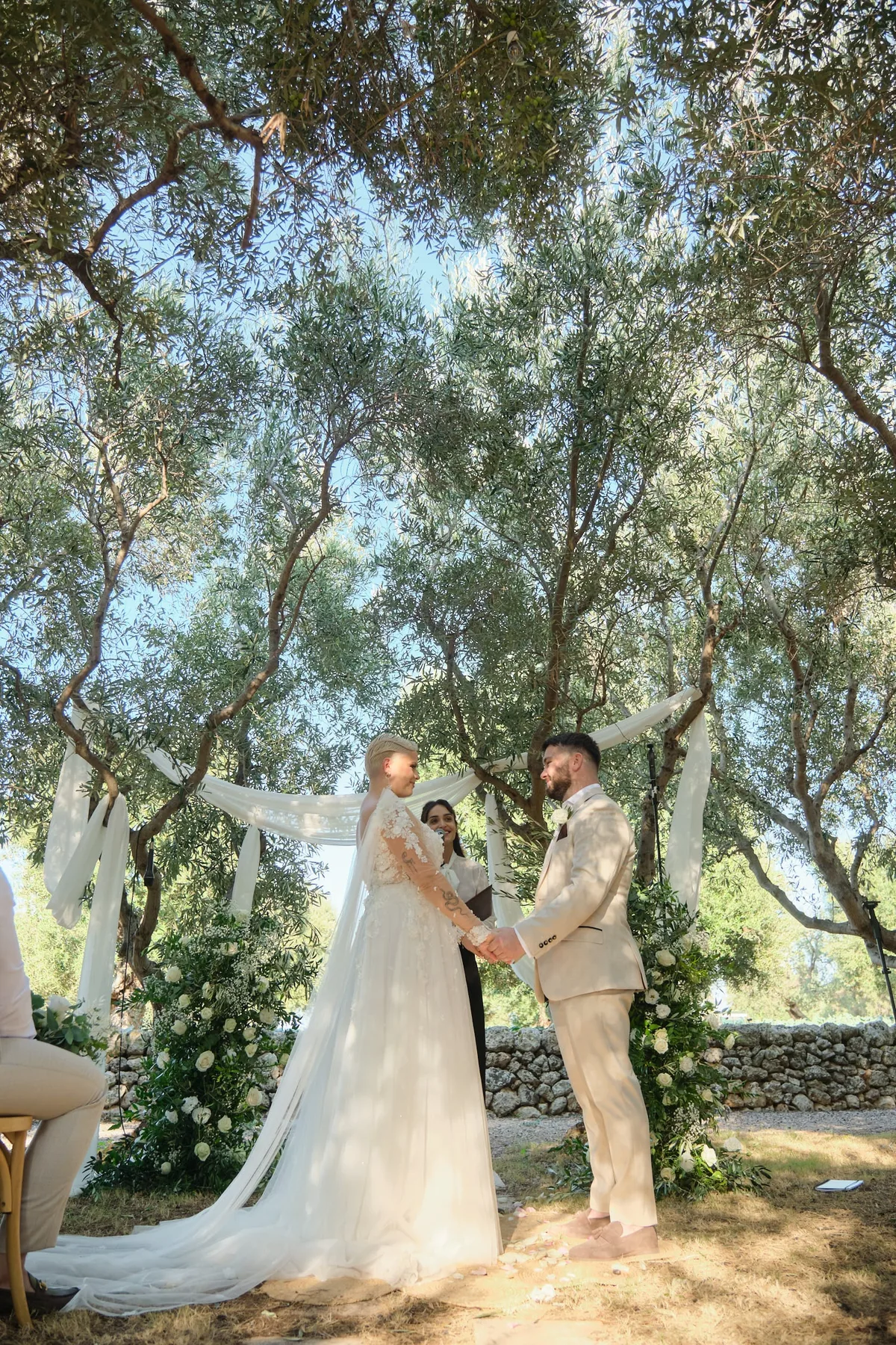 The ceremony beneath the ancient olive trees