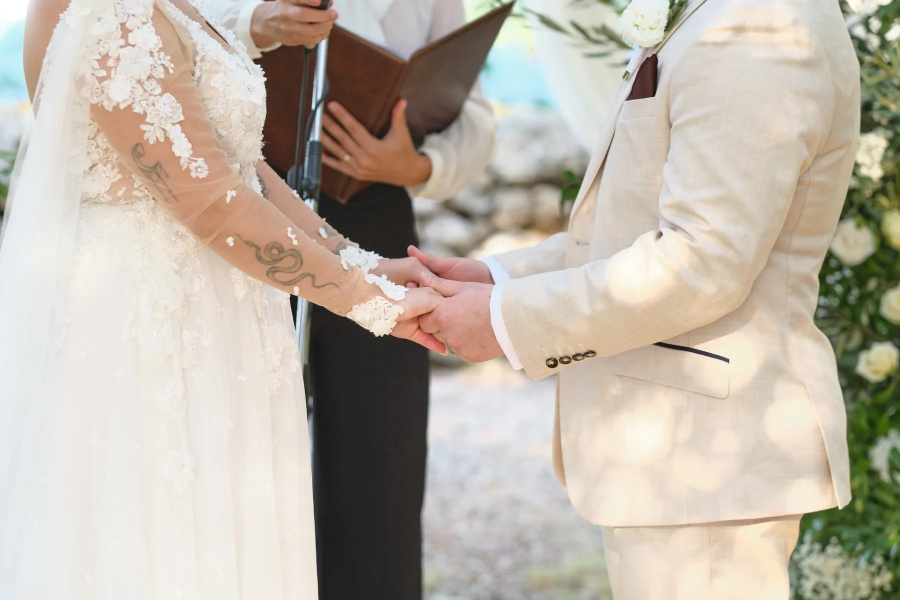 The couple's hands during the ceremony