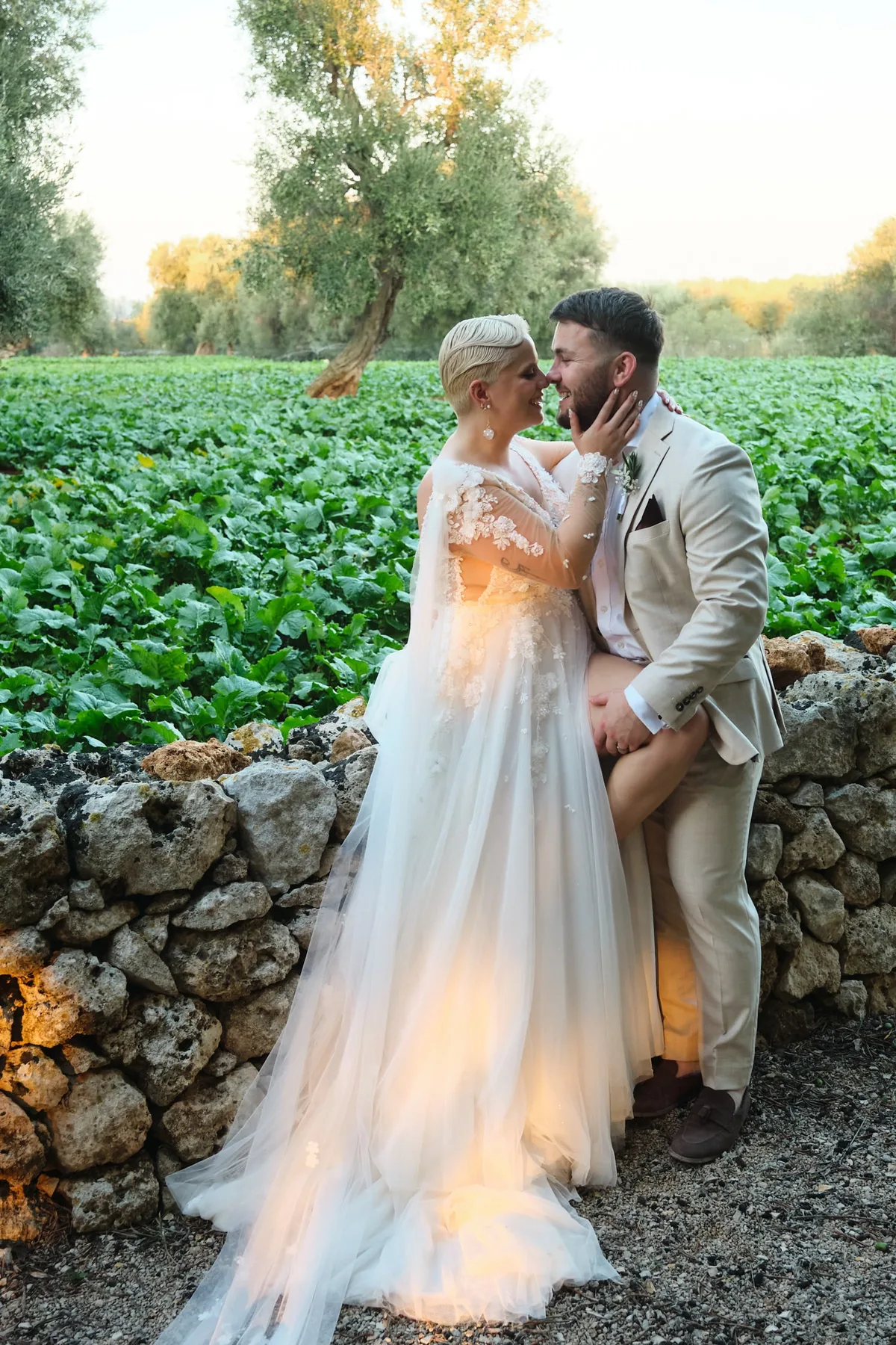 The couple on a dry-stone wall among the fields