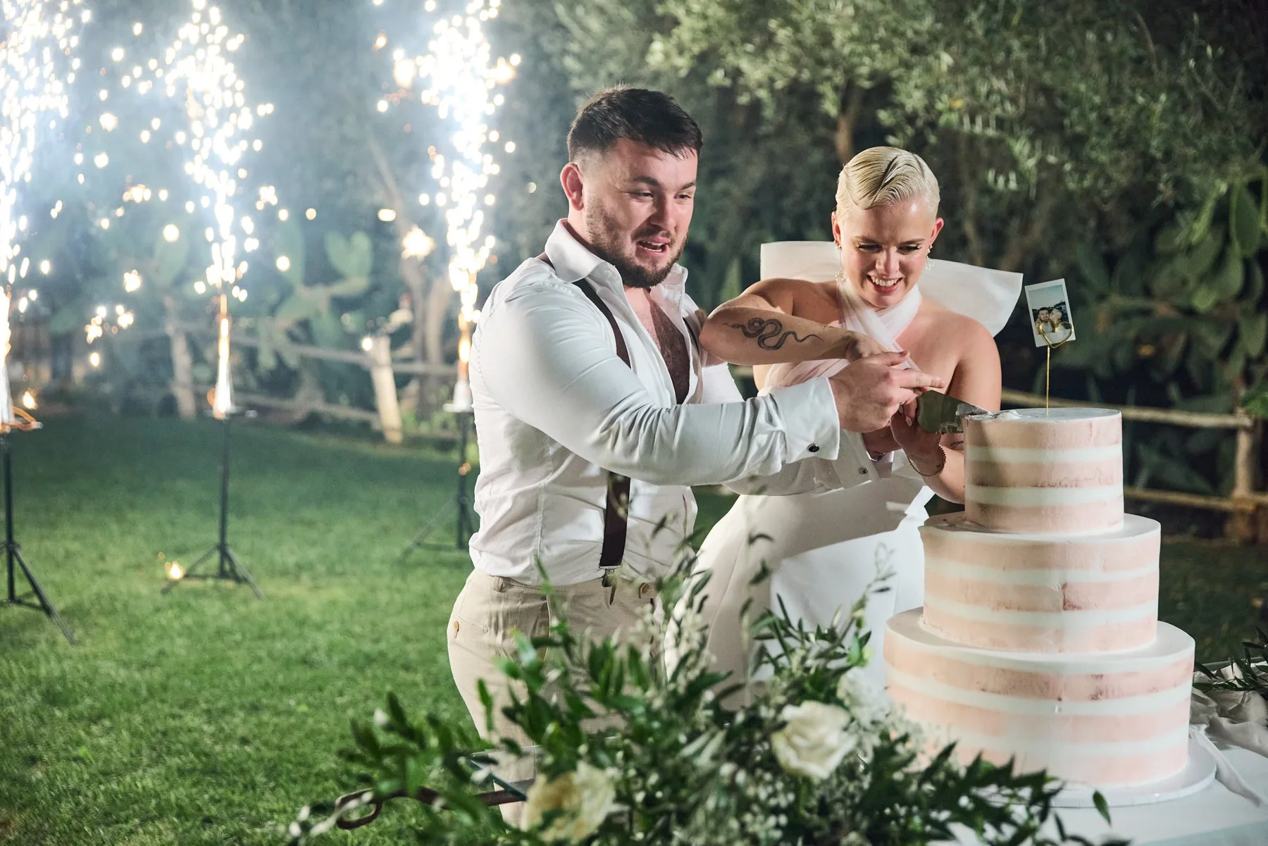 Cutting the cake among the sparklers