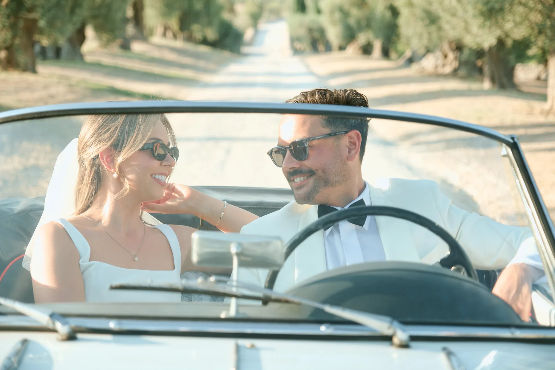 The couple in the convertible car