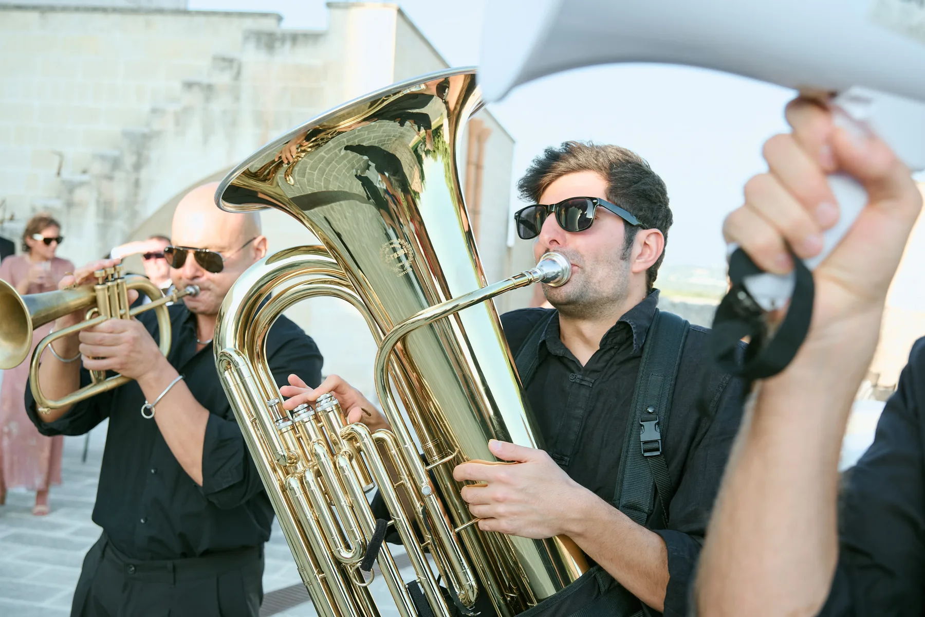The band welcoming guests with brass instruments