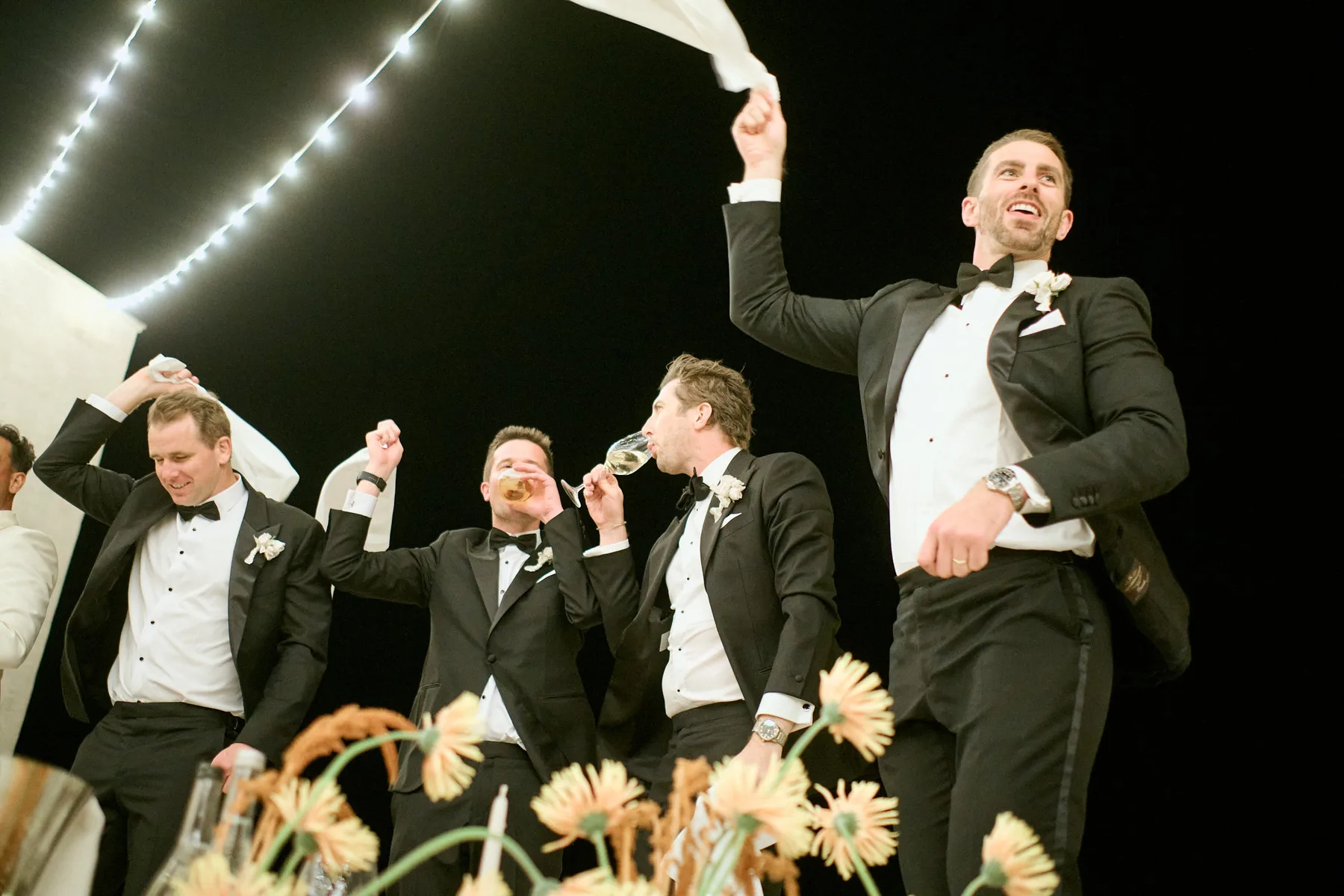 Guests celebrating, waving their napkins
