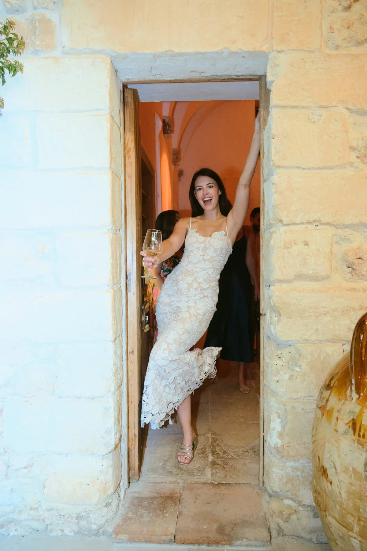 Katy in the masseria's stone doorway during getting-ready