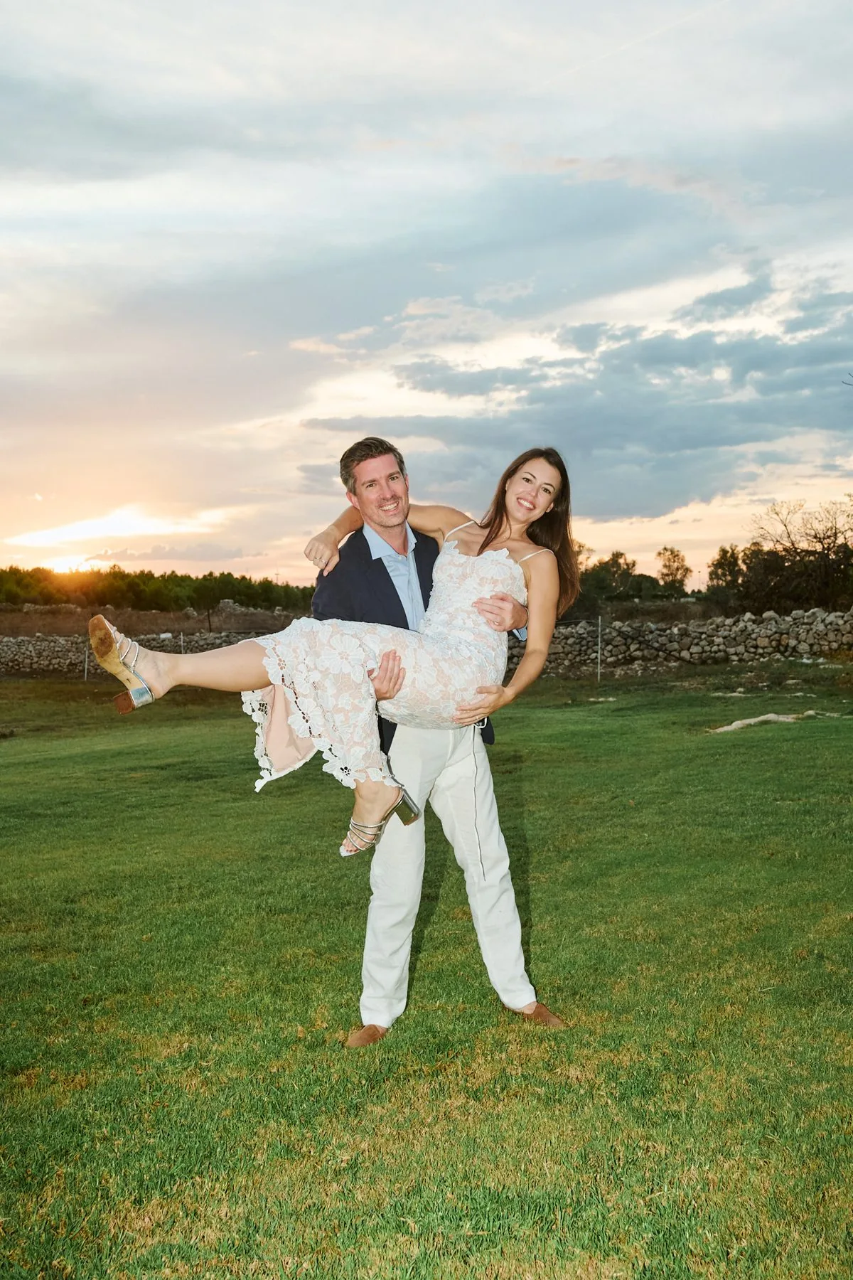 Katy and Gregory embracing in the golden field
