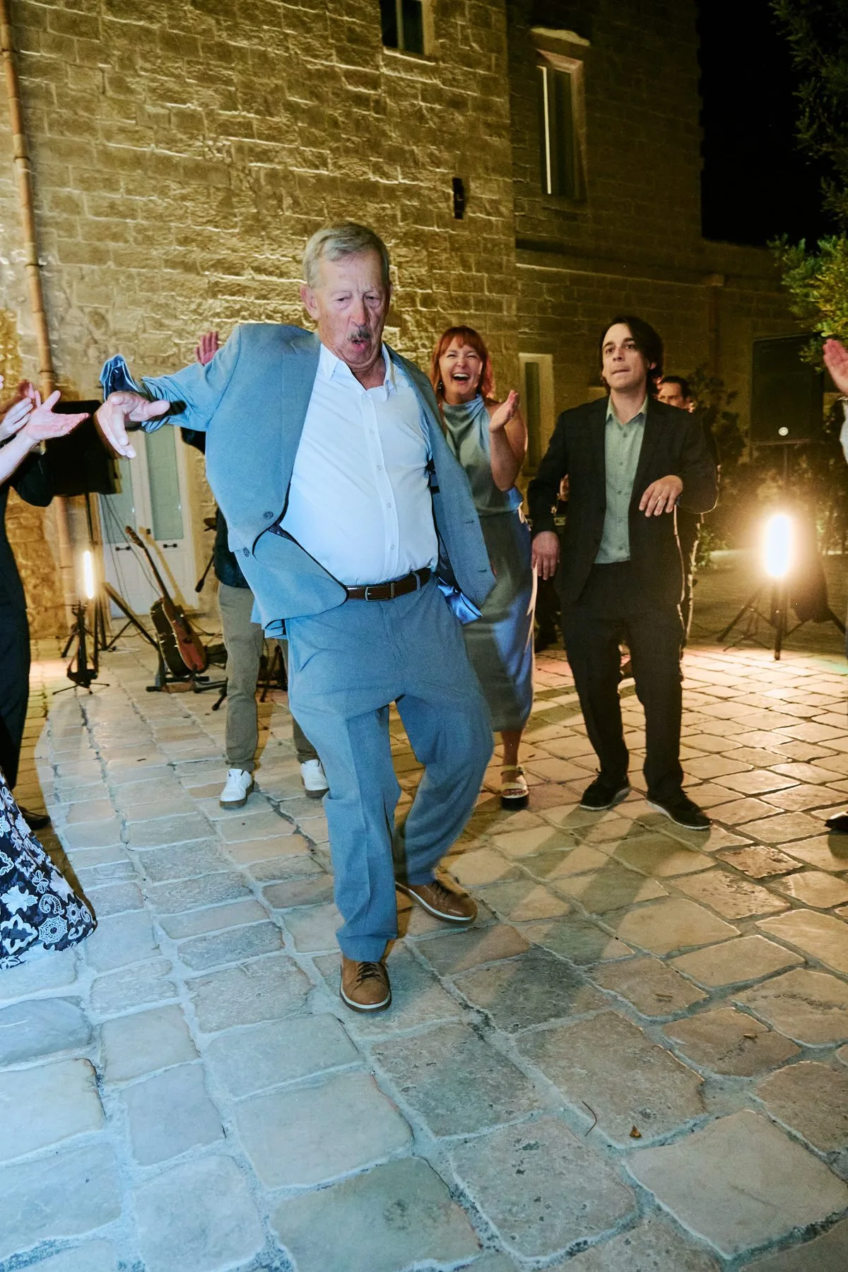 A guest dancing with enthusiasm during the evening party