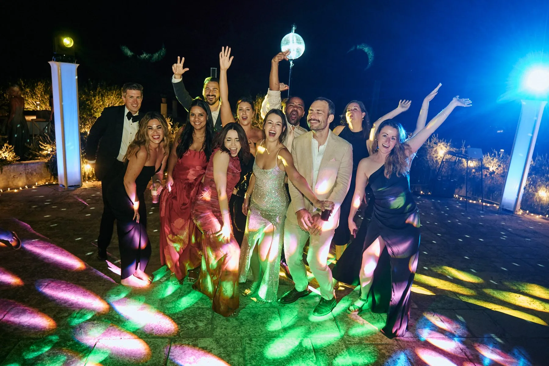 Guests dancing under coloured lights late into the night